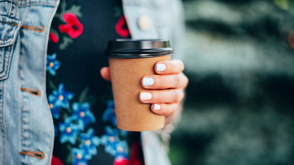 36523702-female-hand-with-coffee-take-away_1500x844.jpg